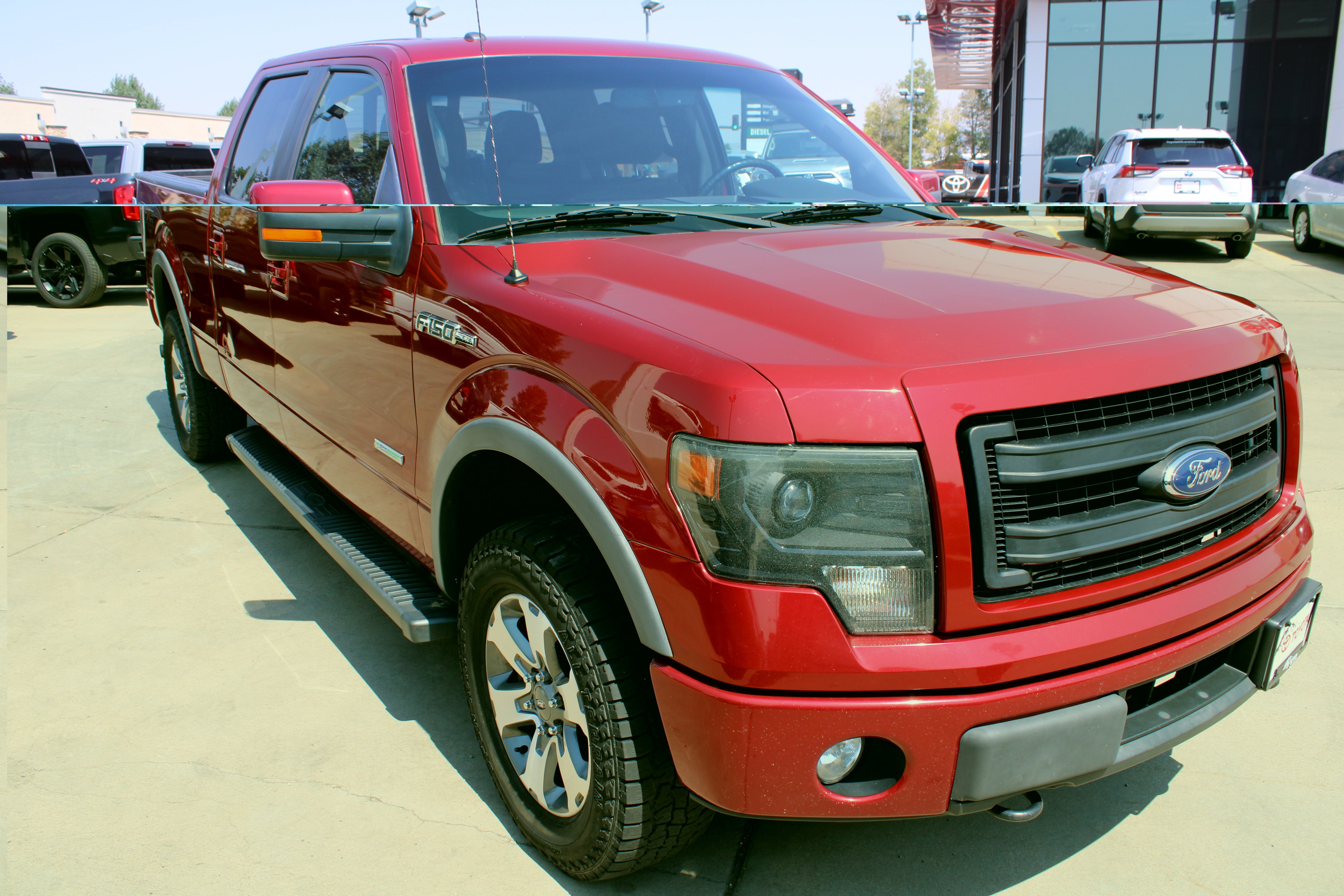 2014 Ford F-150 FX4 in Red — front three-quarter view