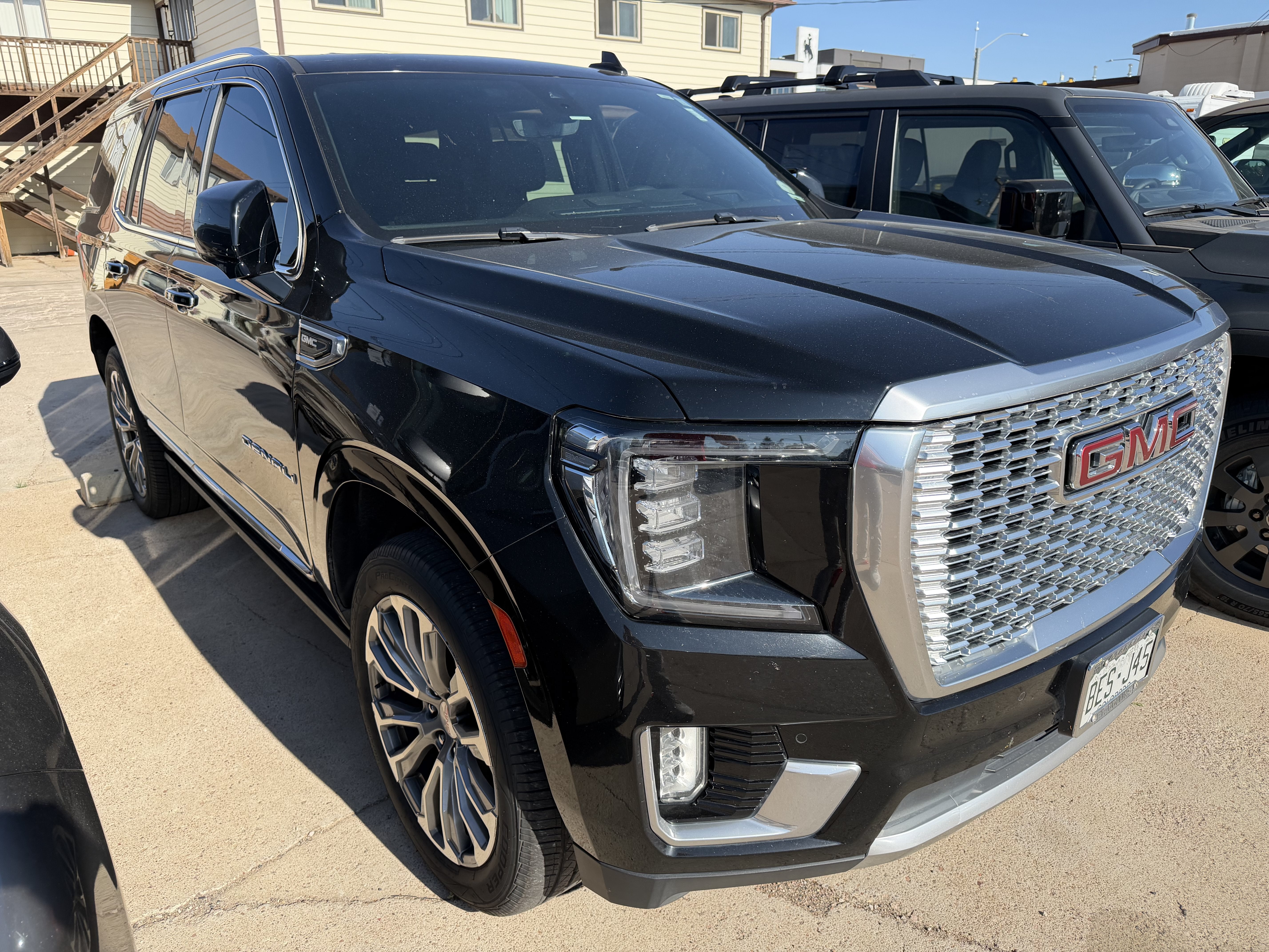 2021 GMC Yukon Denali in Onyx Black — front three-quarter view