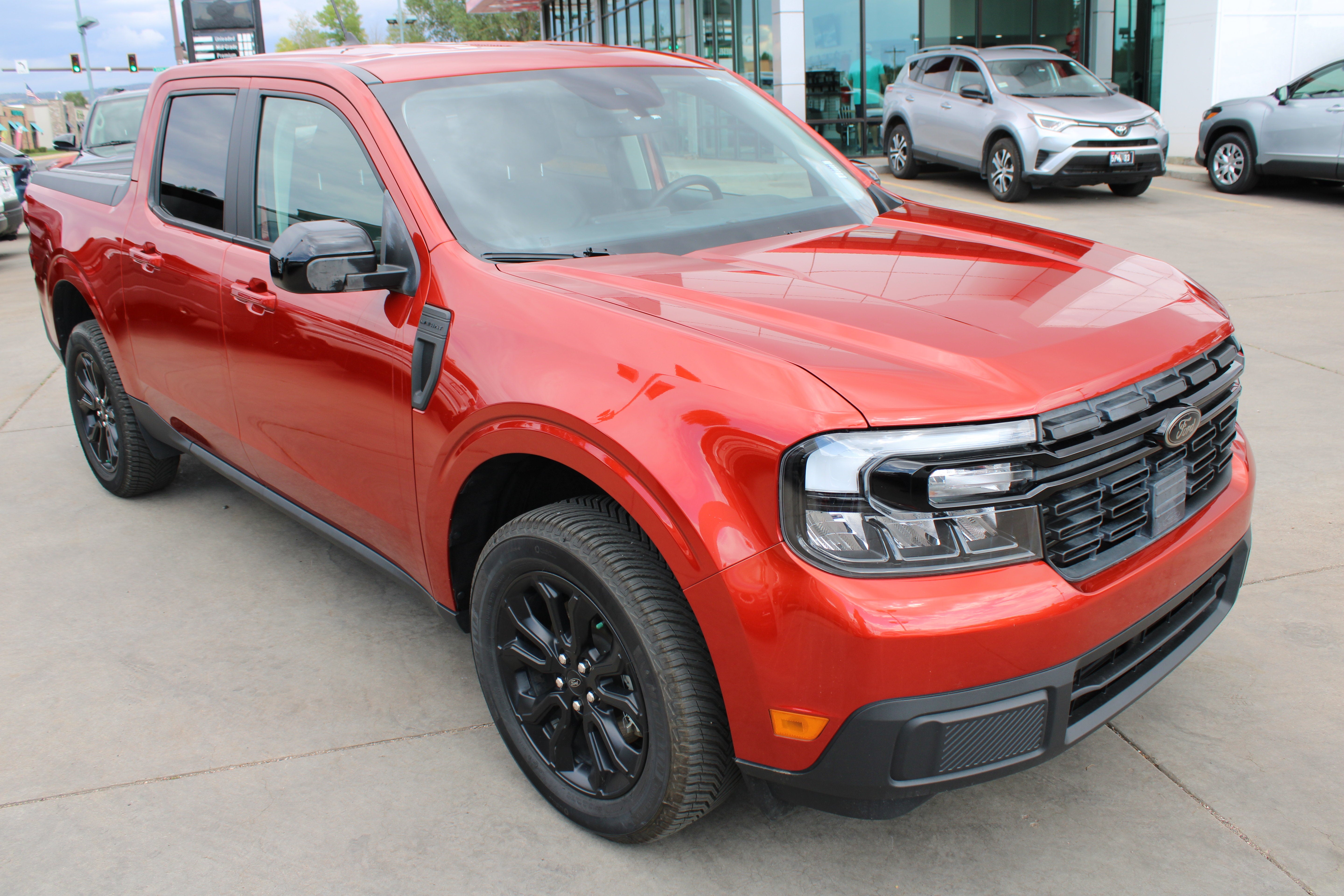 2023 Ford Maverick LARIAT in Red — front three-quarter view