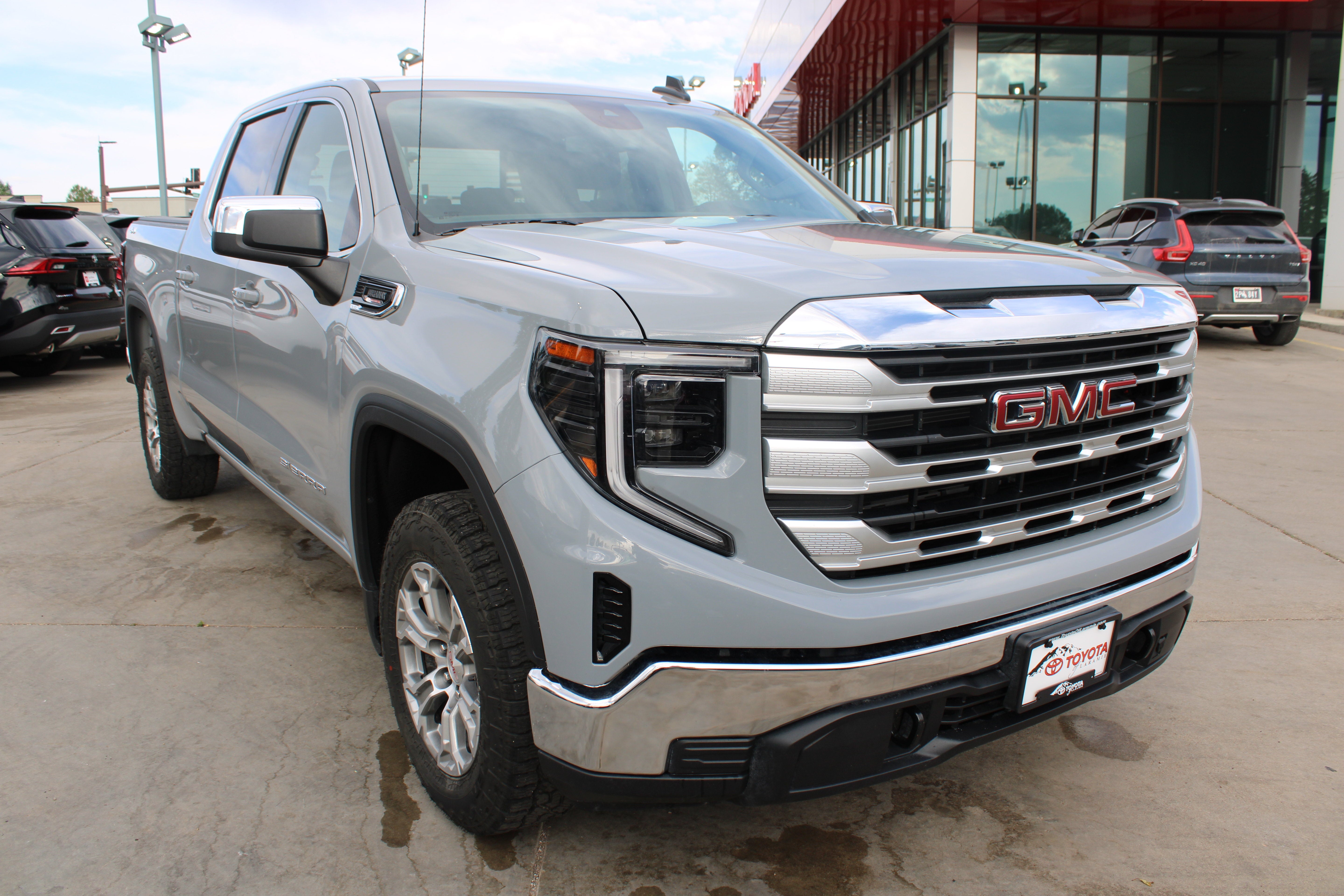 2025 GMC Sierra 1500 SLE in Thunderstorm Gray — front three-quarter view