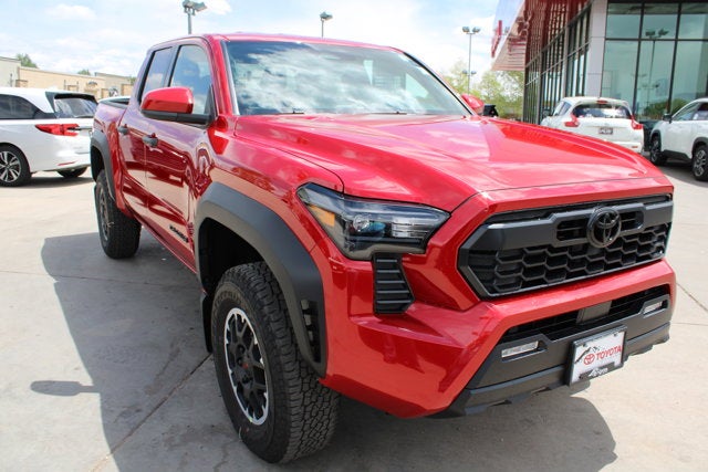 2026 Toyota Tacoma TRD Off-Road in Supersonic Red — front three-quarter view